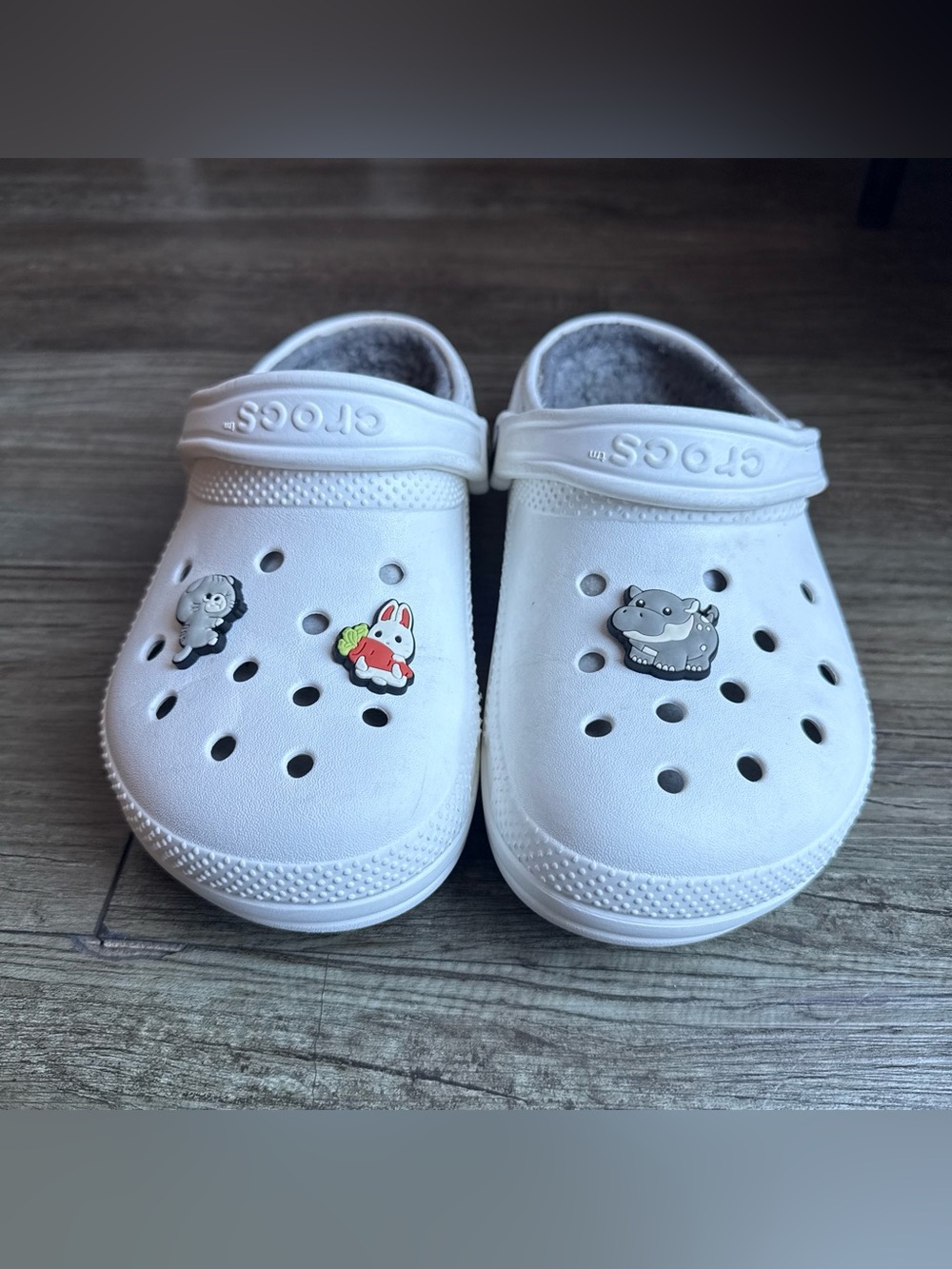 White Crocs with gray lining comes with Jibbitz women’s size 6 men’s size 4